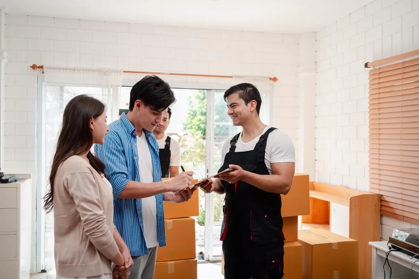 Customers signing paperwork with a mover